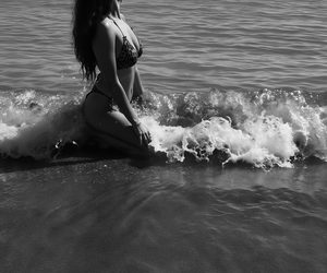 Black-and-white portrait among the waves