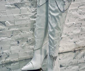 Étoile Blanche Crystal Lace Couture Boots — Asymmetrical lace and crystal chains make each boot feel genuinely custom-made.