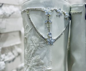 Étoile Blanche Crystal Lace Couture Boots — Brilliant floral crystal details and a crystal chain trace the top of the shaft.