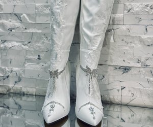Étoile Blanche Crystal Lace Couture Boots — The pair from the front, with crystal compositions descending toward the pointed toes.